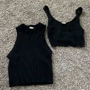 Two black tank tops with stretchy material